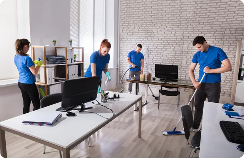 A team of workers cleaning an office